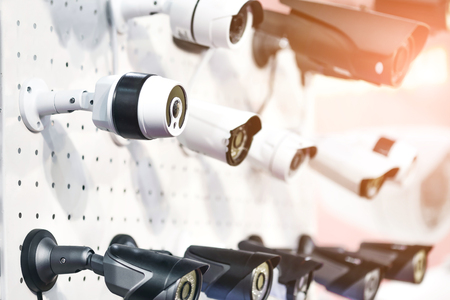 Rows of  white an black professional surveillance camera. Wall m