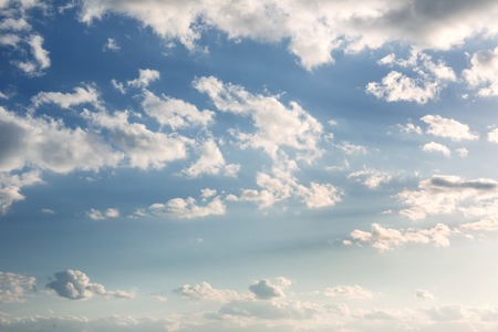 Vibrant blue sky with white clouds. Beautiful nature background.の写真素材