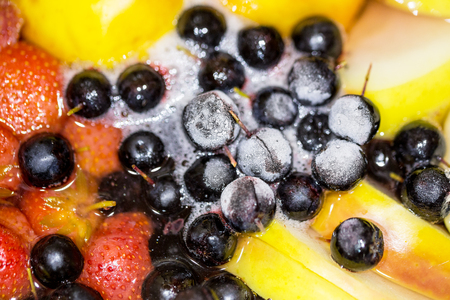Close-up of cooking compote drink from fresh and frozen fruits and berries. Non-alcoholic tasty punch drinkの写真素材