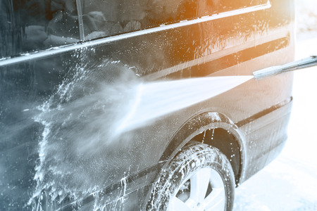 Manual car wash. Washing luxury vehicle with high pressure water pump.Automobile  cleaning self serviceの写真素材