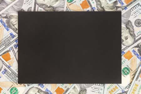 Money background with black mockup. Copyspace dark place for text. US currency one hundred dollar banknotes background. Financial, business and investments concept.の写真素材