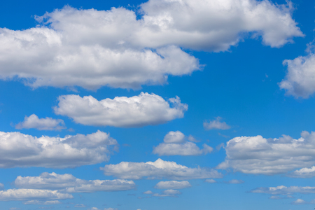 Clear blue sky background with clouds. Vibrant nature sceneの写真素材