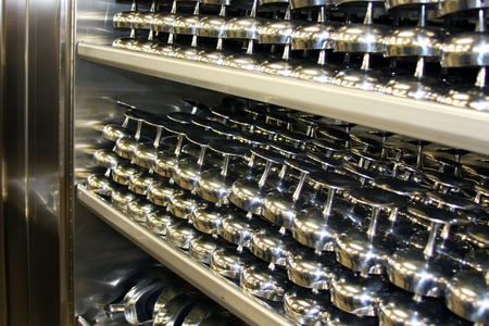 Pile of clean stainless shatterproof metal glasses at cruise ship kithchen. Seasonal job at oceanic cruise liner.の写真素材