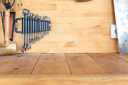 Wooden workbench at workshop. Lot of different tools for diy and repair works. Wood desk for product display. Copyspace.の写真素材