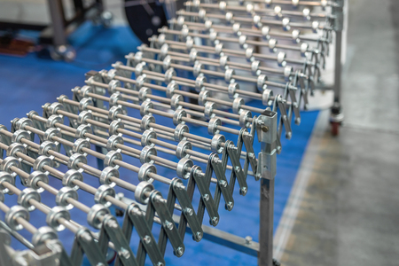 Flexible adjustable roller conveyor. Poratable innovative product's transportation technology for factory and logistic company.の写真素材