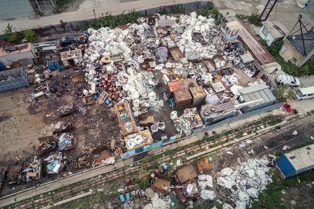 Scrap metal junkyard area aerial view. Reception and storage metal waste before recyclyng.の写真素材