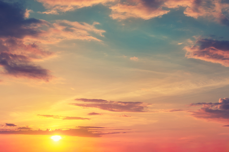 Natural sunset or sunrise with vibrant colors. Dramatic colorful sky background.の写真素材