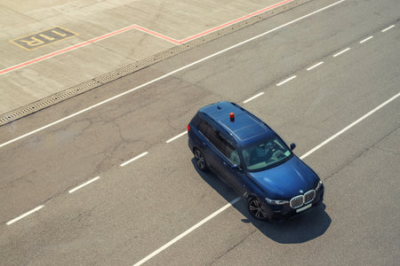 Kyiv, Ukraine - June16th, 2019: Newest big luxury BMW X7 SUV car as safety car with blinkers light...
