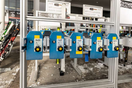 Many ski snowboard storage locker coin cells at peak entrance of station of cabin gondola ski lift...