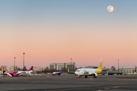 Passenger international ukrainian Kiev Sikorsky airport building terminal and taxiway parking apron with many different aicraft arrival and departure . Kyiv, Ukraine - 15th February, 2022のeditorial素材
