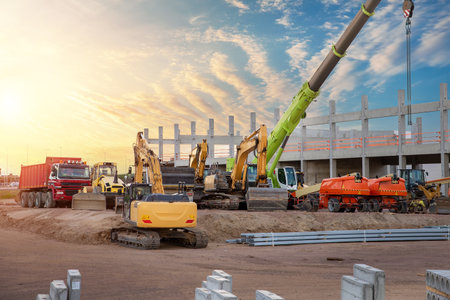 Many different multiclored colorful heavy industrial machinery equipment at construction site...
