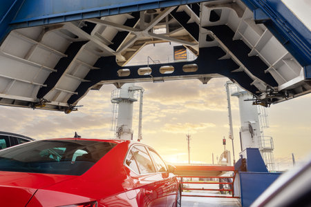 Front open door of passenger freight cargo ferry boat vessel ship with loaded cars and vehicles. Sea transportation ferryboat transport carrier unloading disembark. Northern Europe sea lineの写真素材