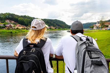 Scenic young adult happy woman portrait enjoy tourism trip National Park Germany mountain valley blue sky sunny day. Europe travel nature landscape destinationの写真素材