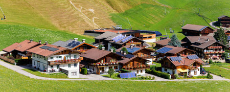 Scenic aerial alpine view austrian mountain village Kals am Grossglockner valley green rural farmland meadow horse pasture background. Austria Alp osttirol National park nature. Summer hiking tourismの写真素材