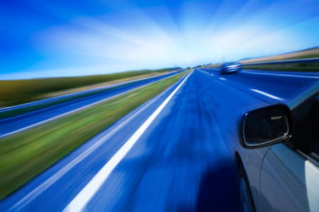 motion blurred road and carの写真素材
