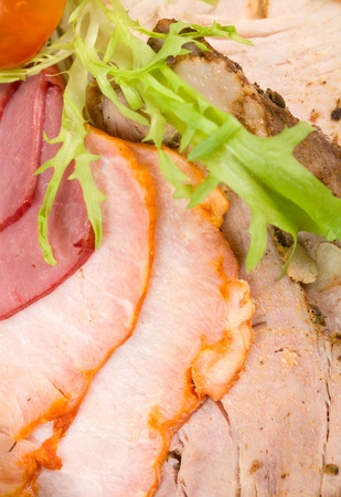 Cutting cured meat on a celebratory tableの写真素材