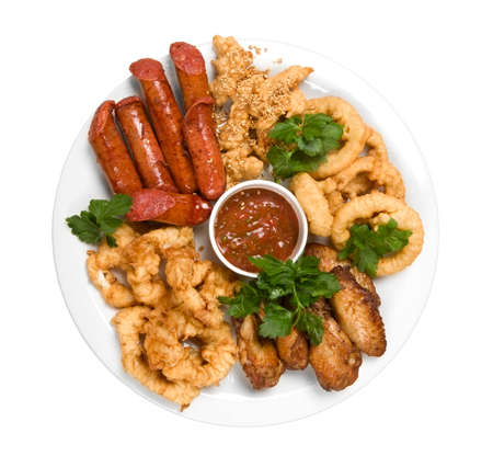 Grilled sausage with sauce and chickenの写真素材