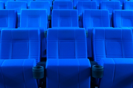 Dark blue rows of theater seatsの写真素材