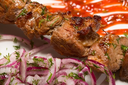 barbecue with sauce and vegetablesの写真素材