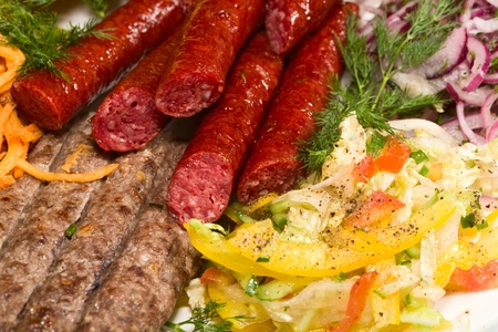 Grilled sausage, barbecue and vegetablesの写真素材