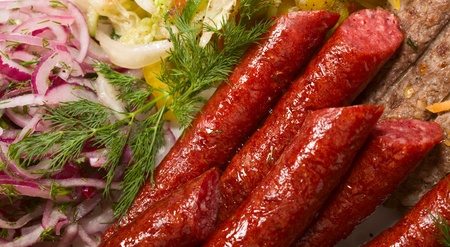 Grilled sausage, barbecue and vegetablesの写真素材