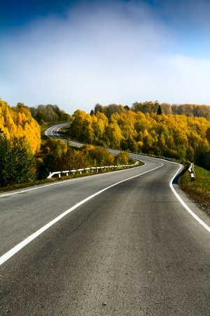 landscape with road and cloudy skyの写真素材