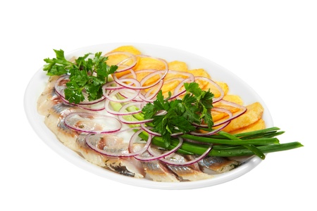 Herring with potatoes and vegetableの写真素材