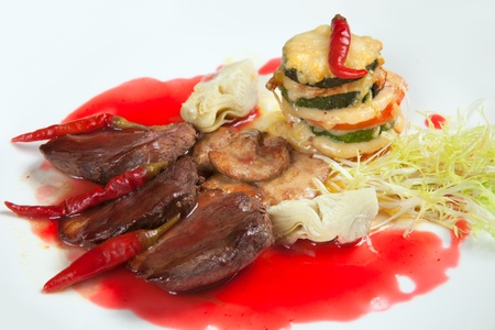 barbecue with sauce and vegetablesの写真素材