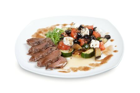 barbecue with sauce and vegetablesの写真素材