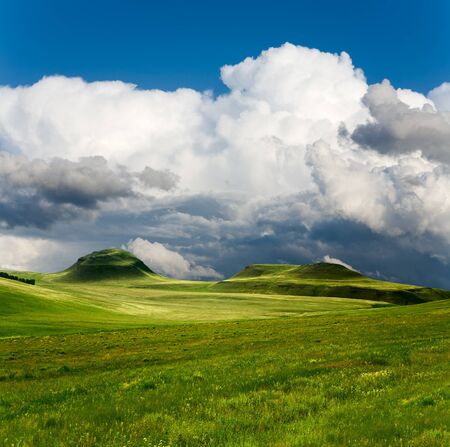 beautiful spring landscape and cloudy skyの写真素材