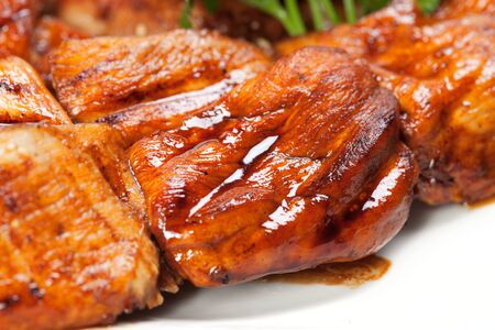 barbecue with sauce and vegetablesの写真素材