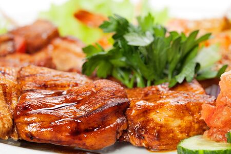 barbecue with sauce and vegetablesの写真素材