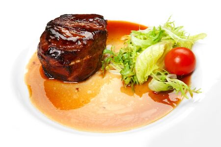barbecue with sauce and vegetablesの写真素材