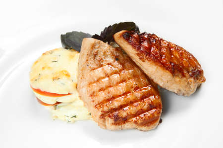 barbecue with sauce and vegetablesの写真素材