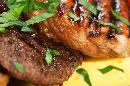 barbecue with sauce and vegetablesの写真素材