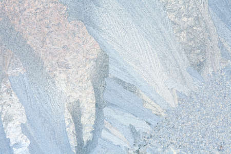Frosty natural pattern on winter windowの写真素材