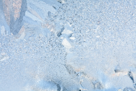 Frosty natural pattern on winter windowの写真素材