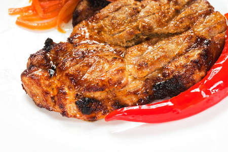 barbecue with sauce and vegetablesの写真素材