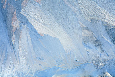 Frosty natural pattern on winter windowの写真素材