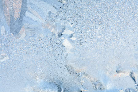Frosty natural pattern on winter windowの写真素材