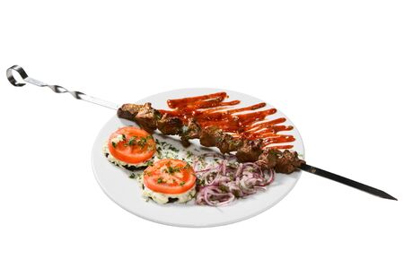 barbecue with sauce and vegetablesの写真素材