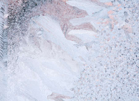 Frosty natural pattern on winter windowの写真素材