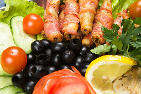 barbecue with sauce and vegetablesの写真素材