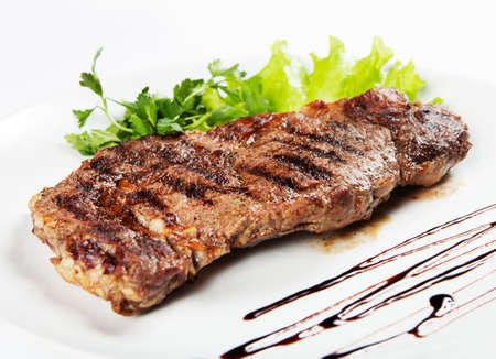barbecue with sauce and vegetablesの写真素材