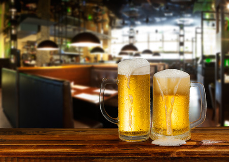 cold light beer mug in a pubの写真素材