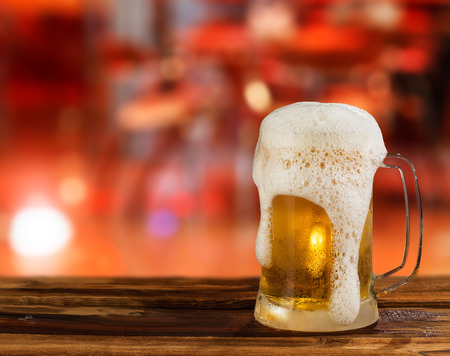 cold light beer mug in a pubの写真素材