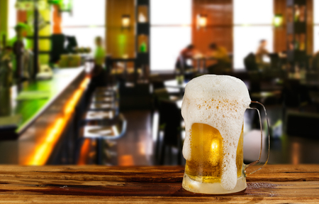 cold light beer mug in a pubの写真素材