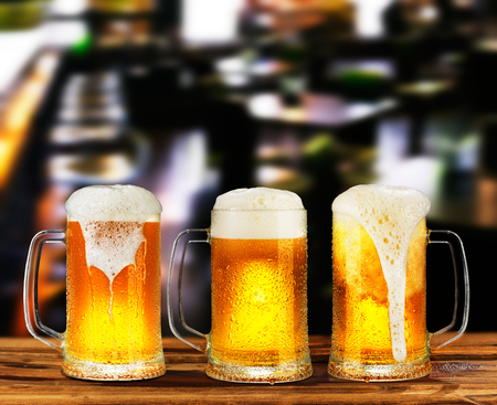 cold light beer glass mug in a pubの写真素材