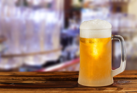 cold light beer glass mug in a pubの写真素材