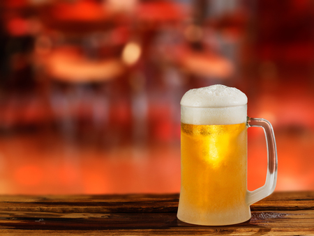 cold light beer glass mug in a pubの写真素材